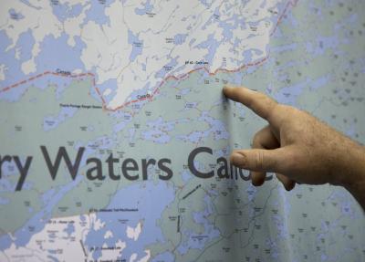 Pointing at map of the Boundary Waters Canoe Area Wilderness