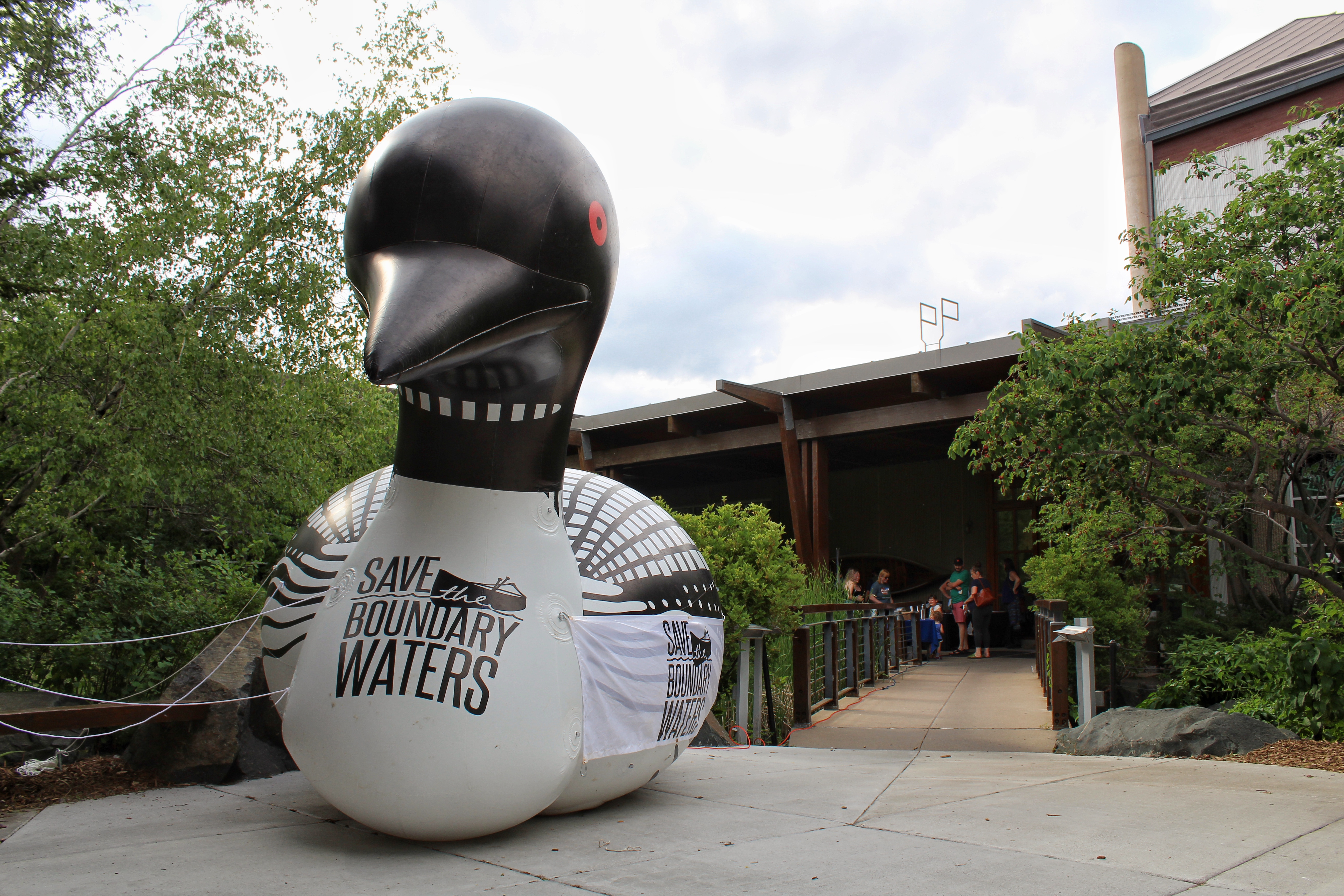 A large inflatable loon sits in front of the Bloomington REI Co-op