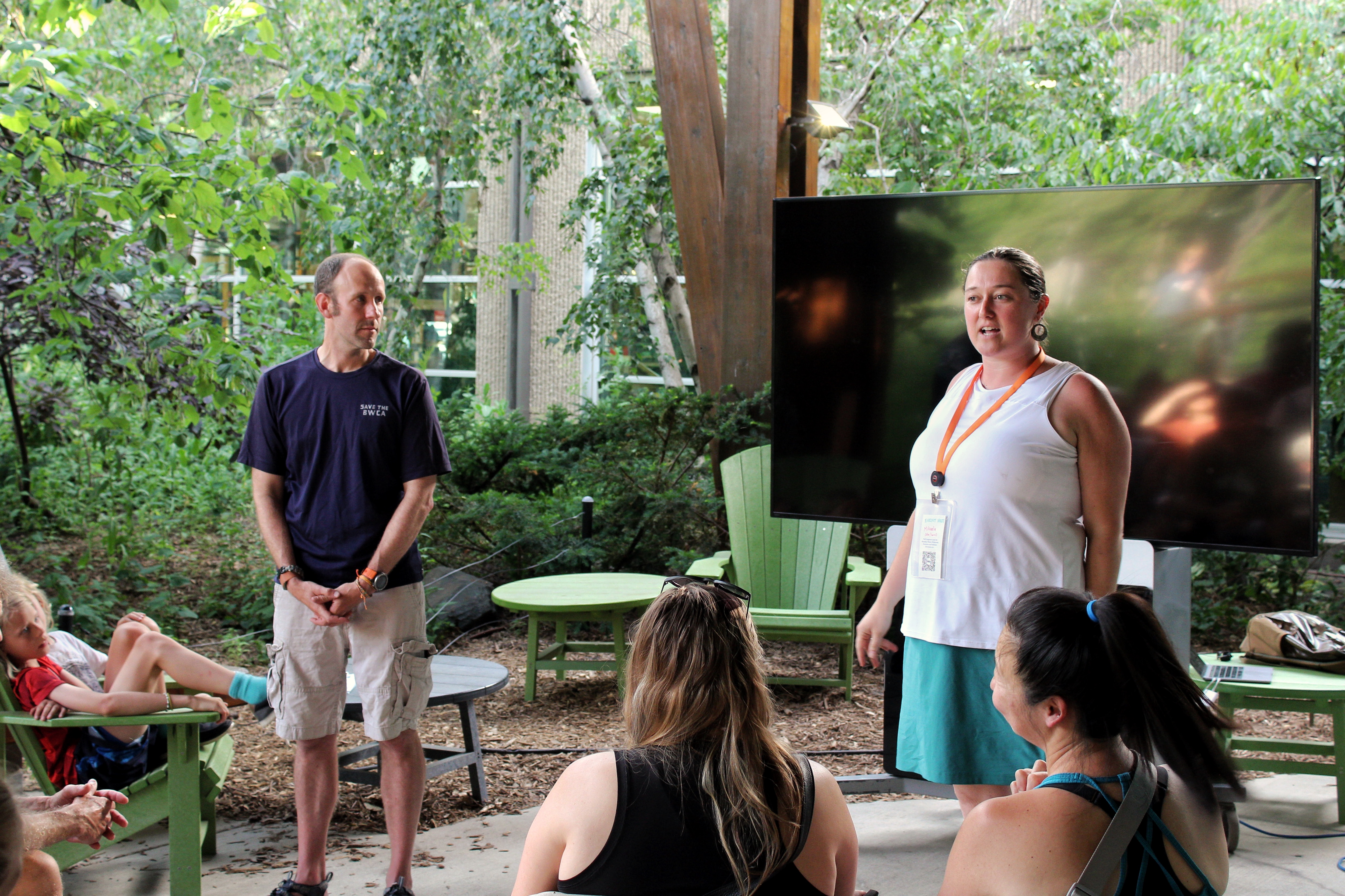 Campaign Manager Alex Falconer and REI Brand Engagement Coordinator Mikaela Swanlund address supporters prior to the screening of Boundary Waters Traverse