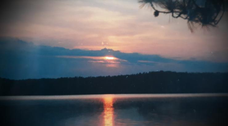 Photo of Boundary Waters Sunset with blue sky and black border