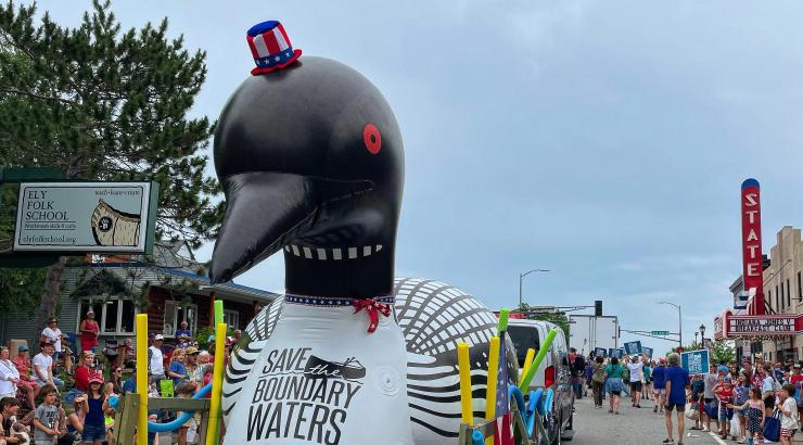 Loon inflatable on float in town