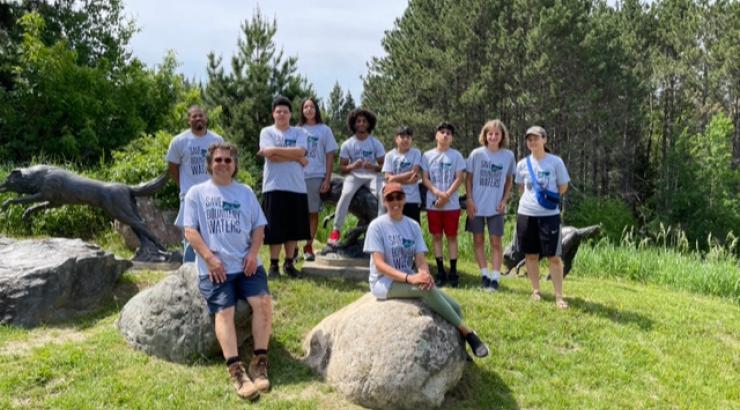 Circle of Discipline trip attendees pose together for a photo in their Save the Boundary Waters t-shirts