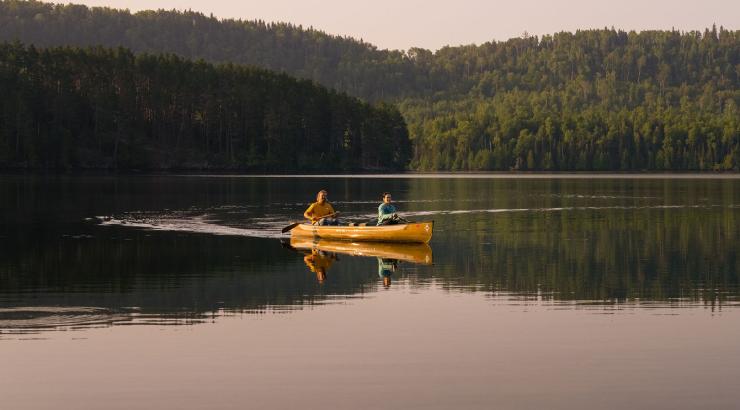 Two people paddling a canoe in the Boundary Waters canoe Area Wilderness