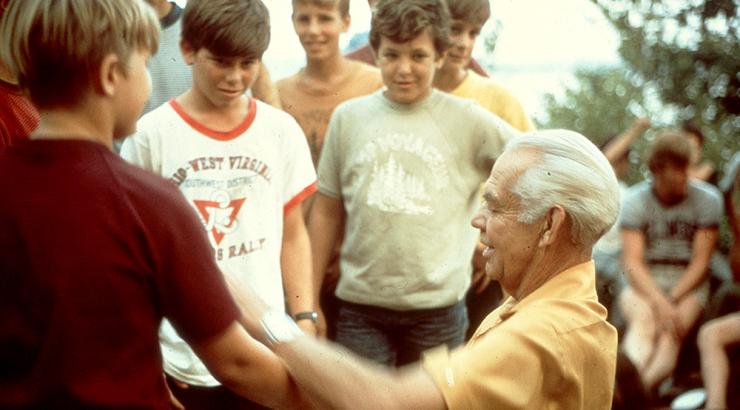 Environmental activist Sigurd Olson speaks with a group of campers at Camp Voyageurs near the Boundary Waters