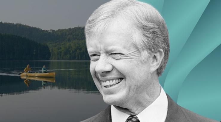 Jimmy Carter with Boundary Waters image and blue graphic behind him