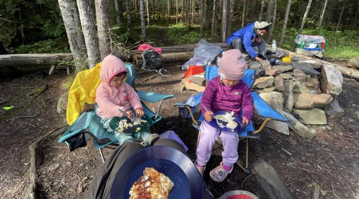 two children enjoying a chilly day at Wilderness camp site
