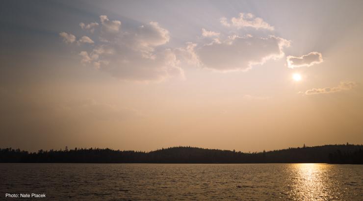 A photo of a sunset over a Boundary Waters lake.