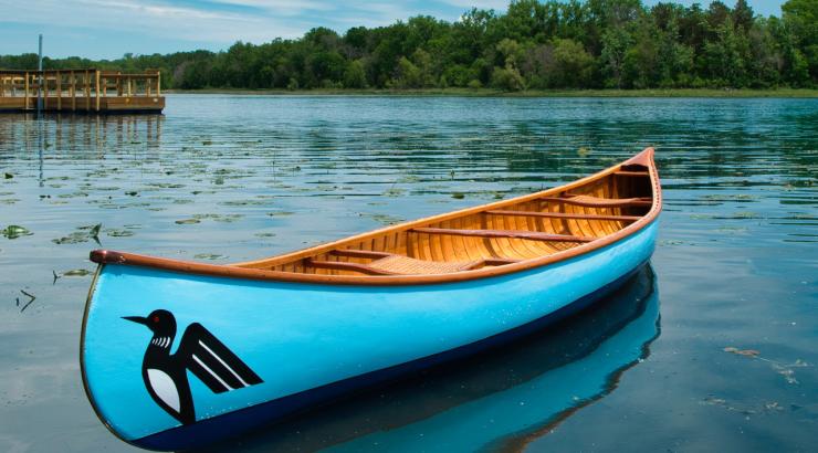 hand-built cedar canoe floating on pristine BWCA lake