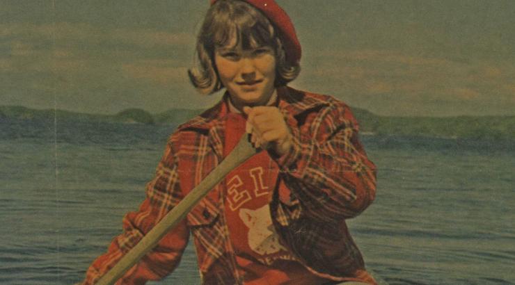 vintage photo of woman holding canoe paddle