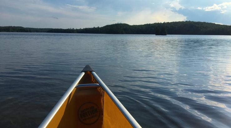 Photo of front of the canoe, taken from the front seat while on water