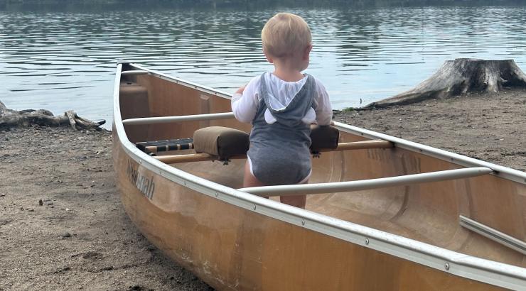 one year old in canoe