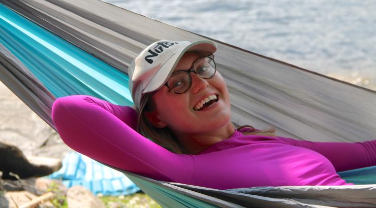 Photo of volunteer Audrey Jewett smiling in hammock