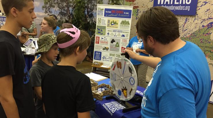 Save the Boundary Waters volunteer spinning prize wheel for 2 people