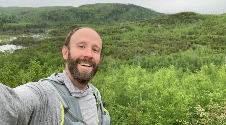 Selfie of Alex Falconer overlooking Boundary Waters