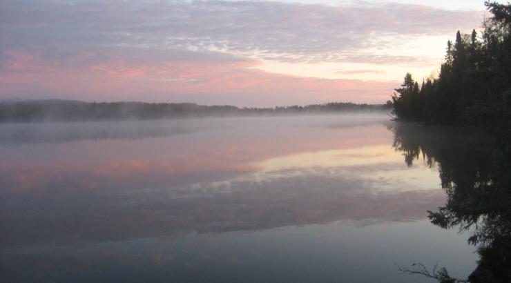 boundary waters sunset with pink and blue sky reflecting on water