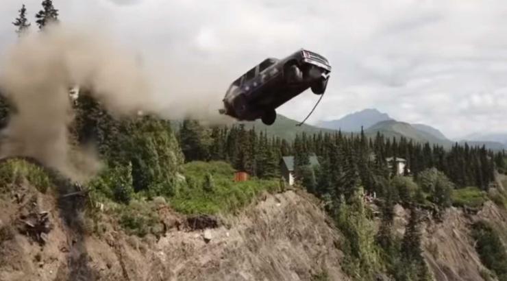 A car flies off a cliff.