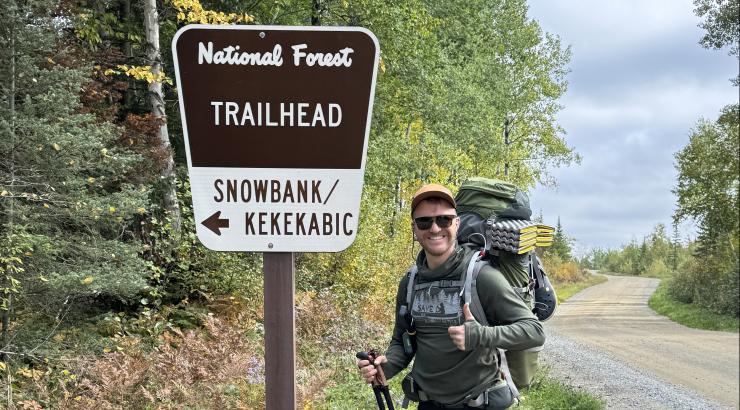 Standing at the Snowbank Lake trailhead sign. Photo: Adam Hinterland