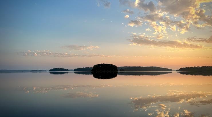 Morning light over water and Quetico.