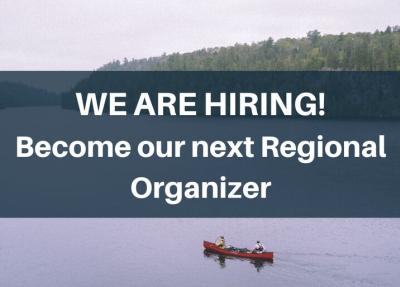 now hiring text over lake with canoe and trees by shoreline