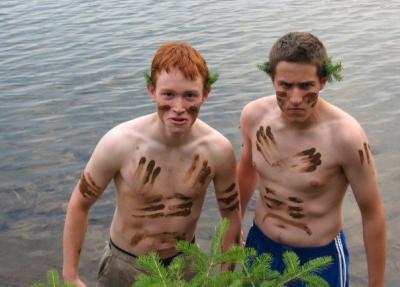 Lloyd and friend standing in lake covered in mud