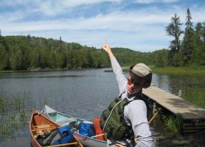 Lloyd posing in canoe