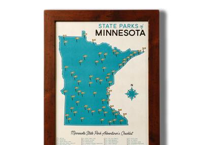 Photo of a map of MN state parks poster in a wood frame