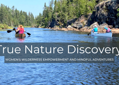 "True Nature Discovery" - photo of women paddling canoes in the BWCA