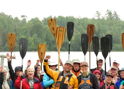 People holding paddles up 