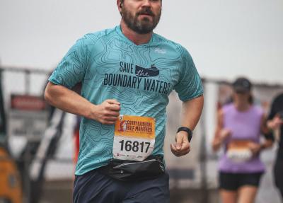 Runner in Save the Boundary Waters shirt