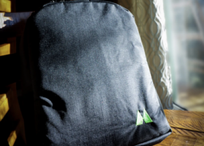 A black backpack with a small Idea Mountain logo on the right bottom corner