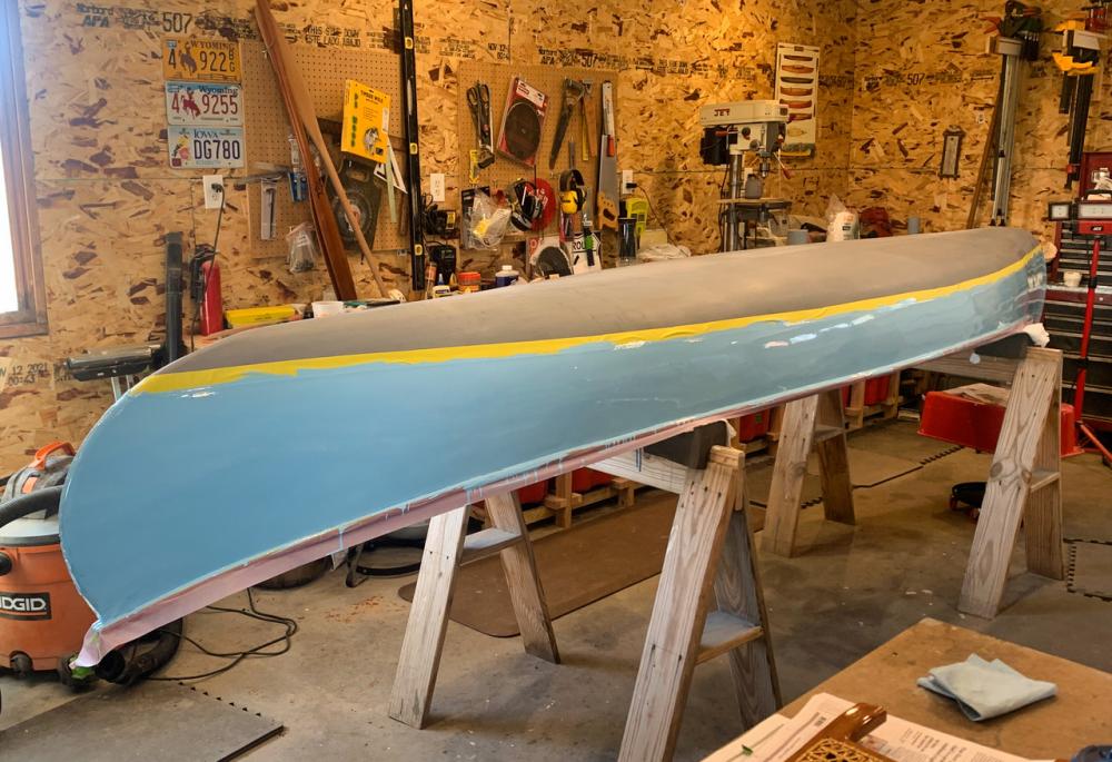 Filling and painting the canvas exterior in marine enamel blues
