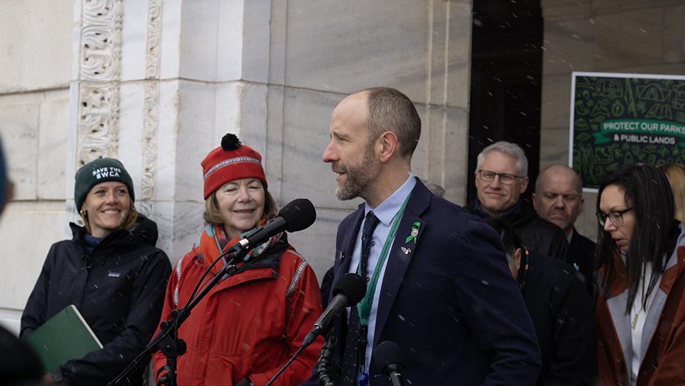 State Representative Alex Falconer speaking at the state capitol. 