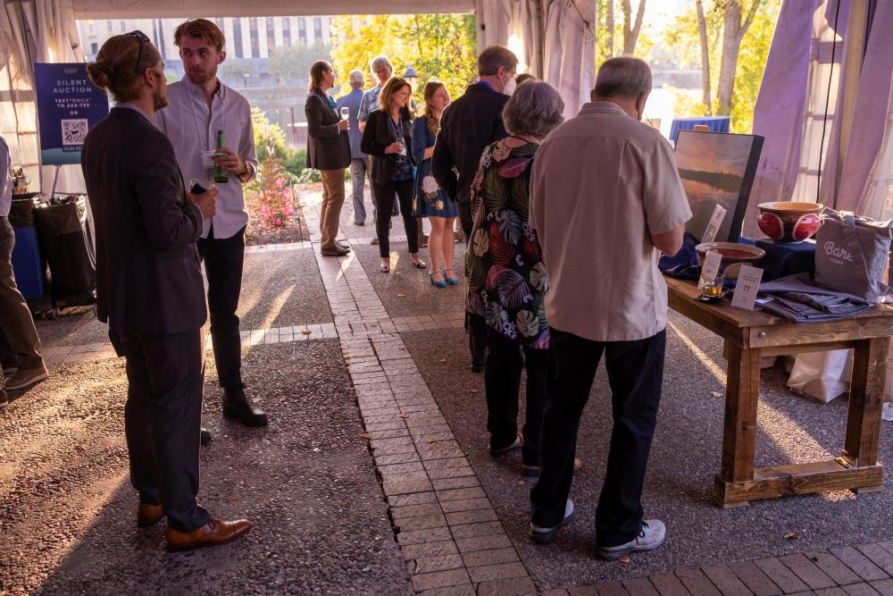 People standing around live auction