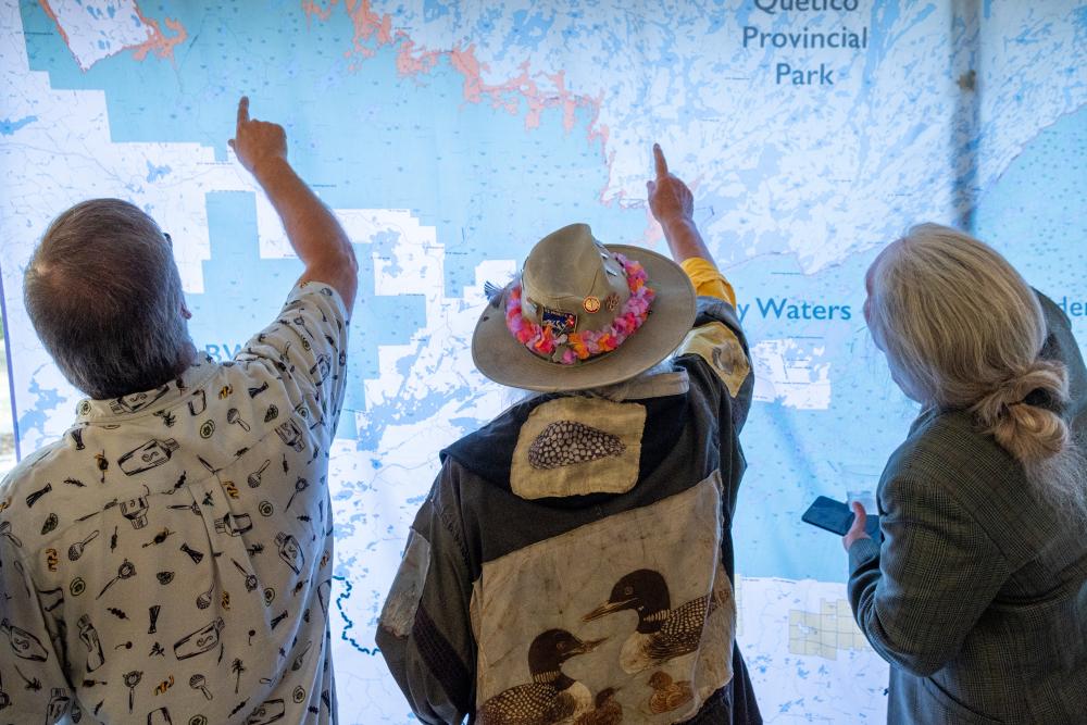 people pointing at map