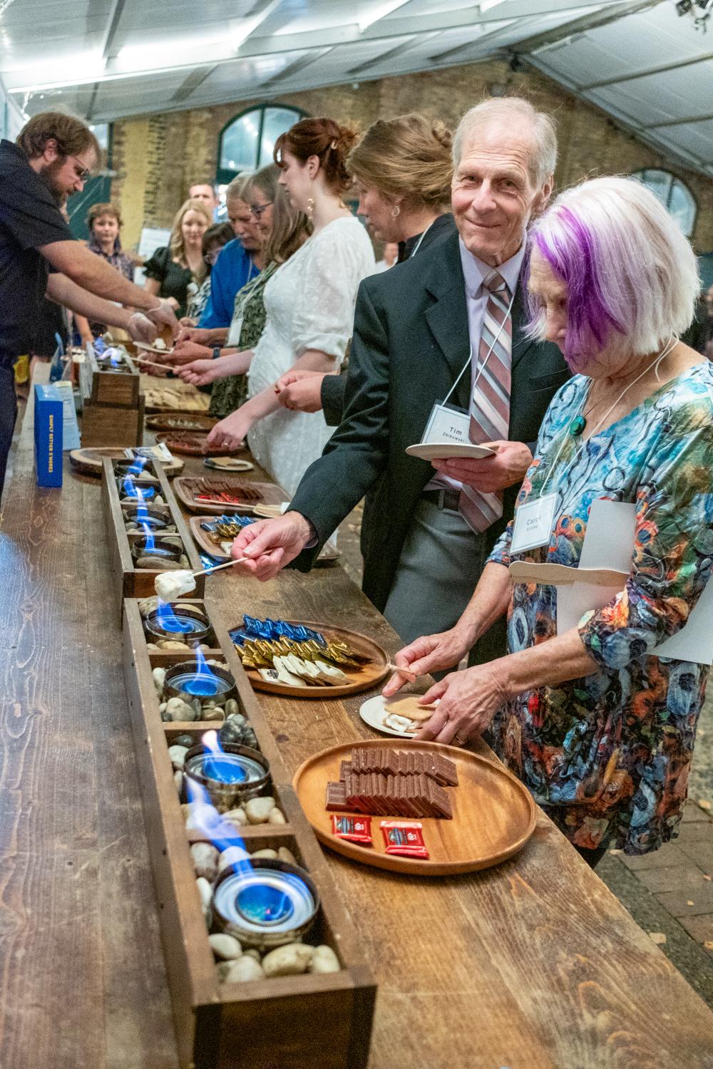 attendees enjoying s'mores