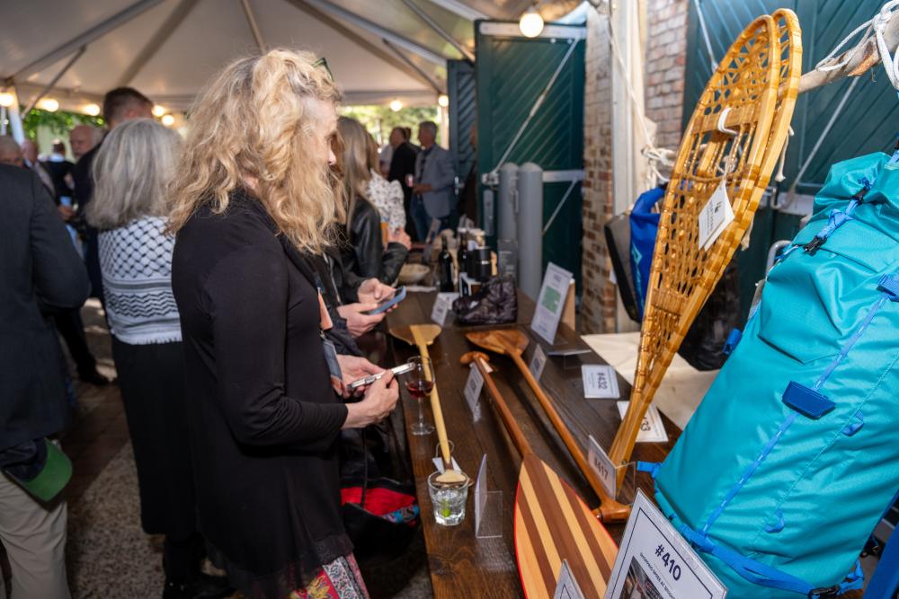 woman looking at auction items