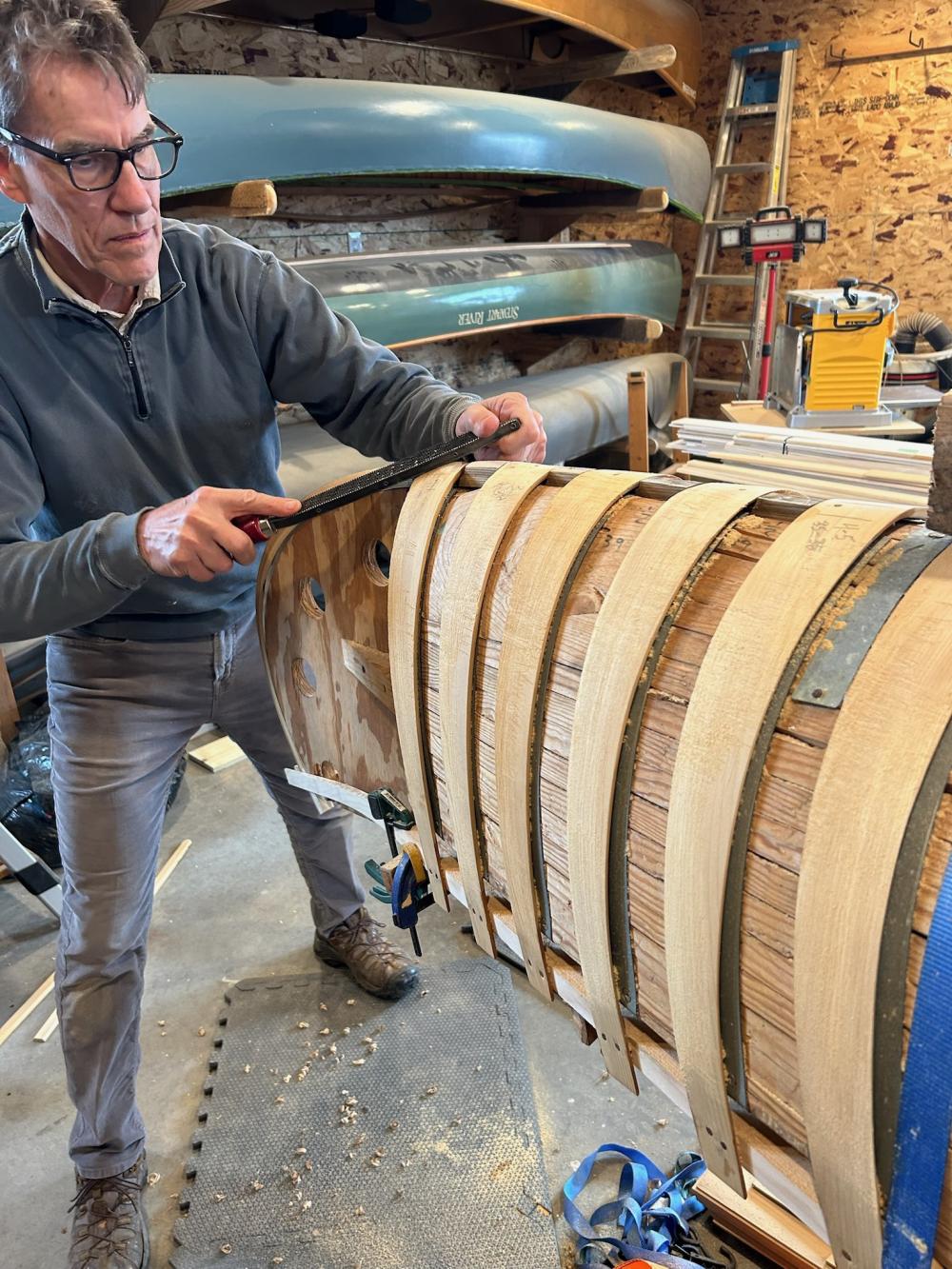 Steam bending and installing cedar ribs over a solid form