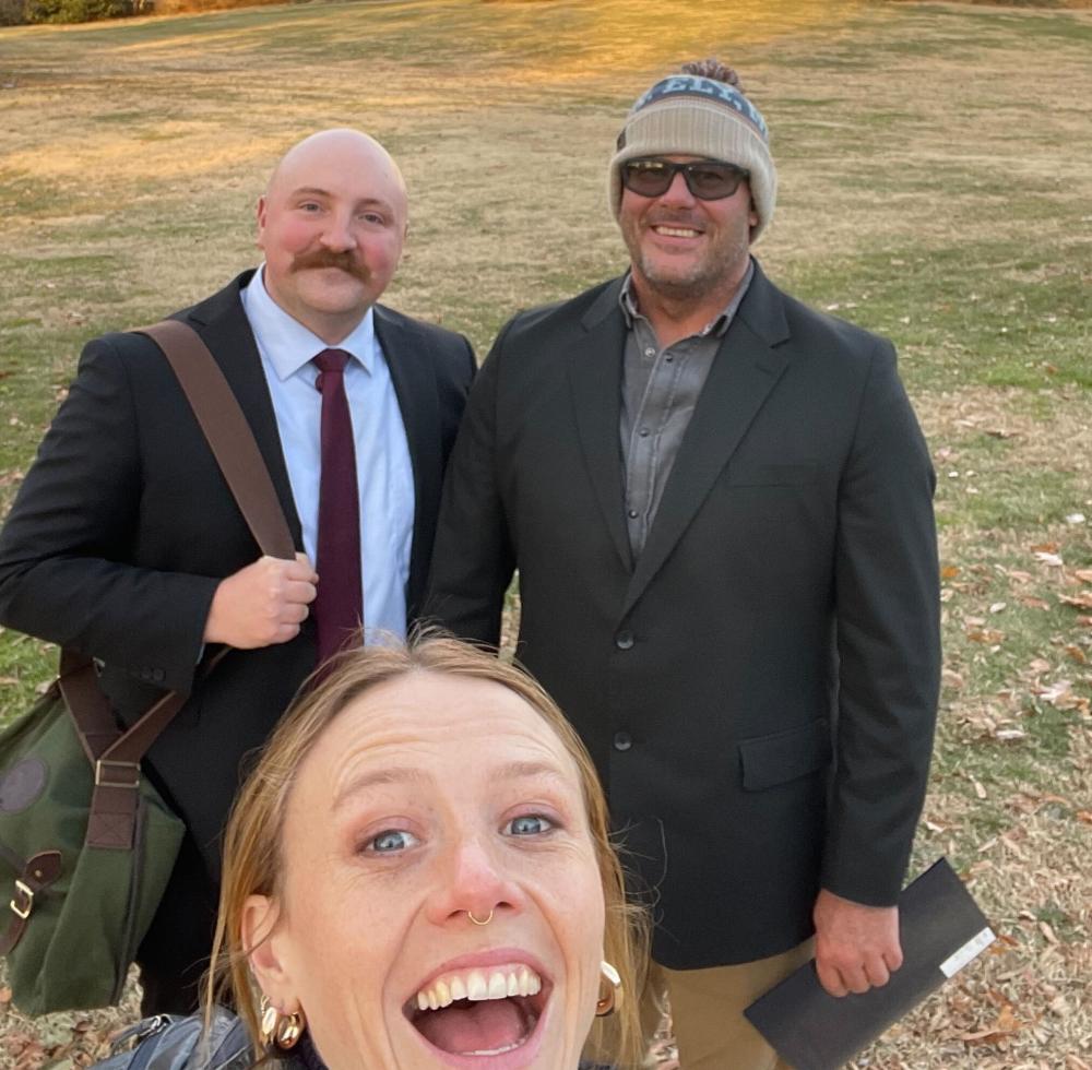 3 people in front of capitol