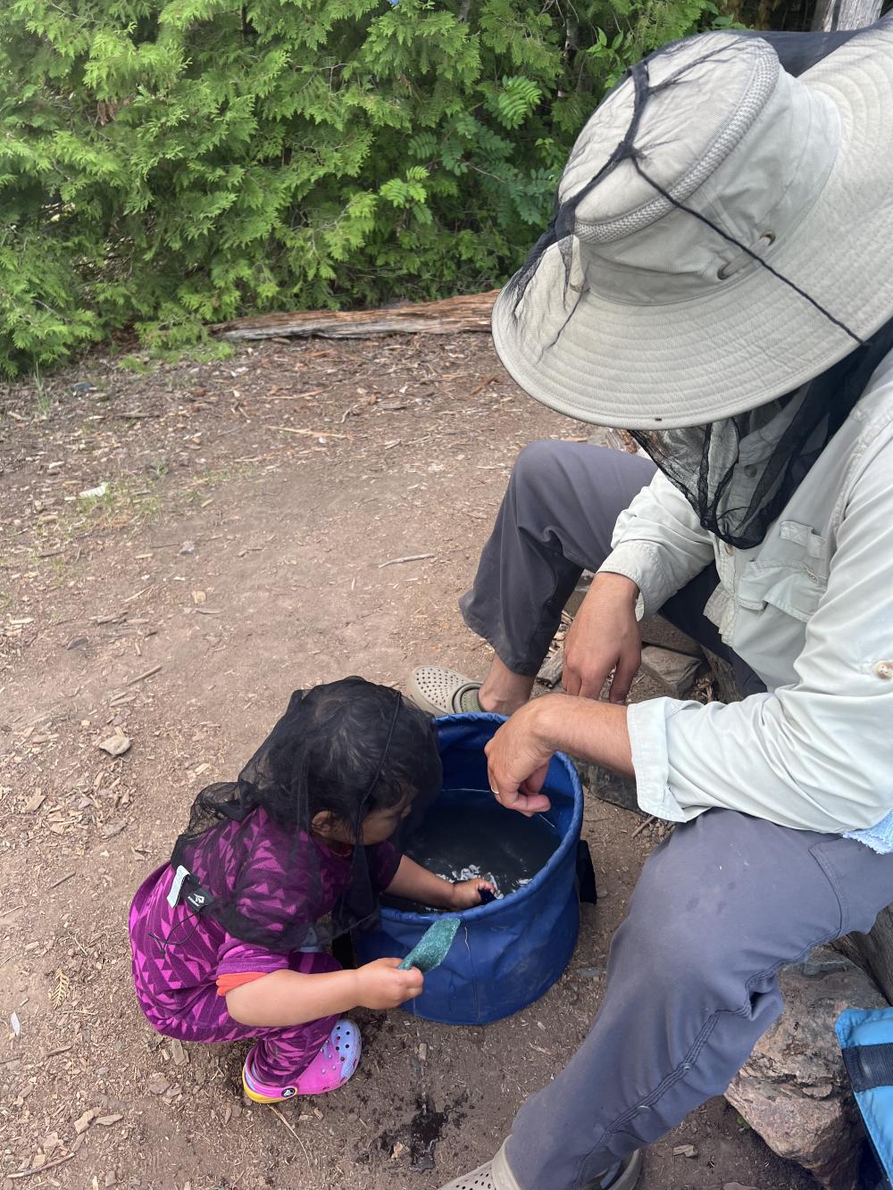 Children playing on the ground in the Boundary Waters
