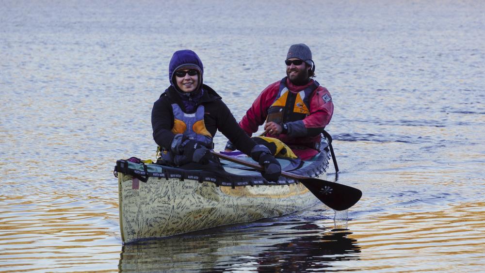 Dave and Amy Freeman sit in their signature-covered canoe during a leg of their Paddle to DC adventure advocacy project.