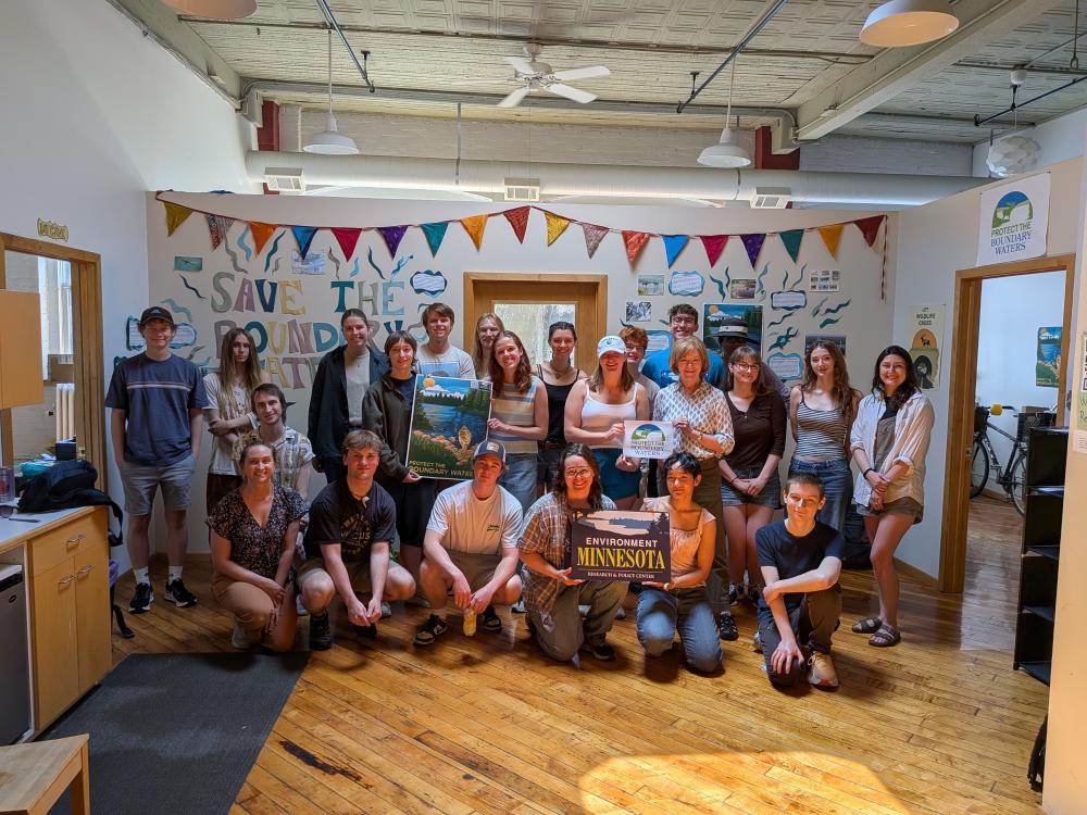 Group of people in Canvass office posing with Senator Tina Smith
