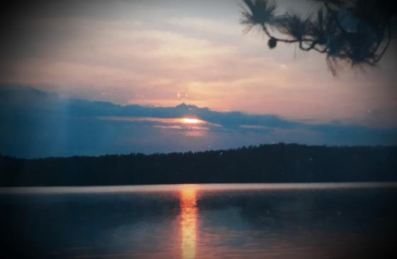 Photo of Boundary Waters Sunset with blue sky and black border