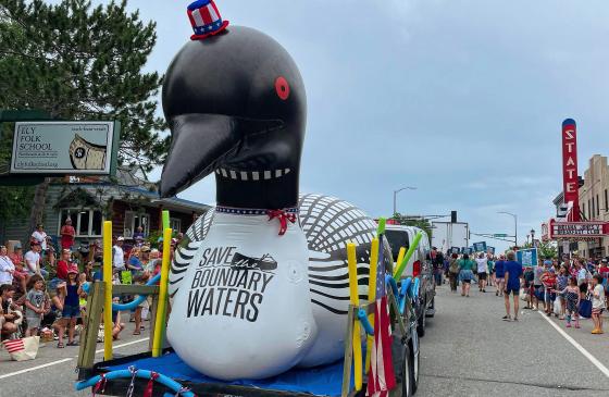 Loon inflatable on float in town