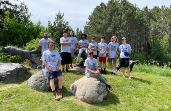 Circle of Discipline trip attendees pose together for a photo in their Save the Boundary Waters t-shirts