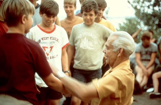 Environmental activist Sigurd Olson speaks with a group of campers at Camp Voyageurs near the Boundary Waters