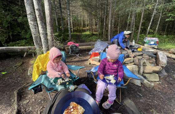 two children enjoying a chilly day at Wilderness camp site