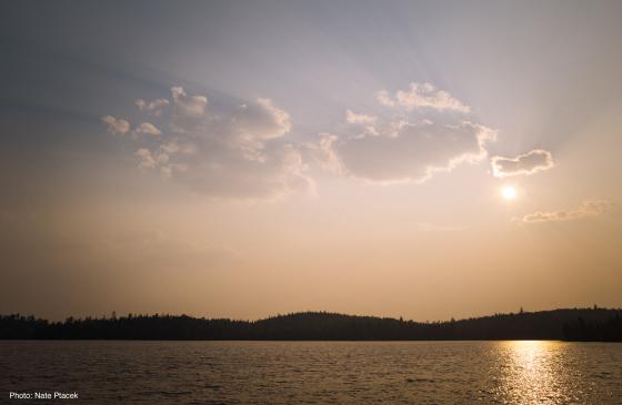 A photo of a sunset over a Boundary Waters lake.