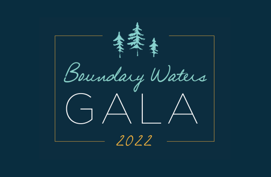 A navy blue graphic that says "Boundary Waters Gala 2022" surrounded by teal-colored pine trees