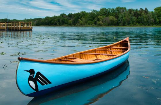 hand-built cedar canoe floating on pristine BWCA lake