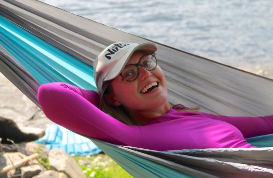 Photo of volunteer Audrey Jewett smiling in hammock